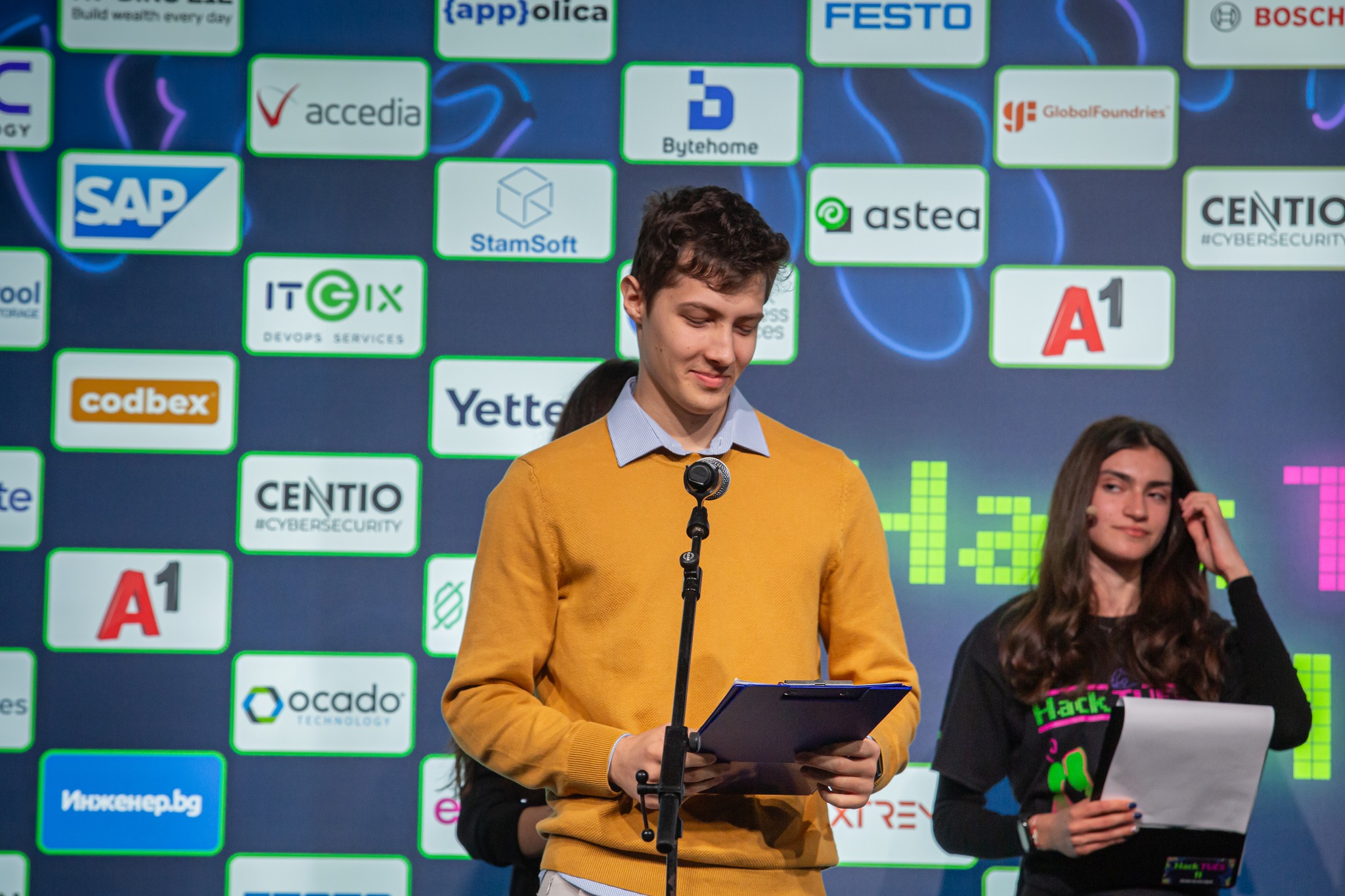 Picture of me talking at HackTUES 2025